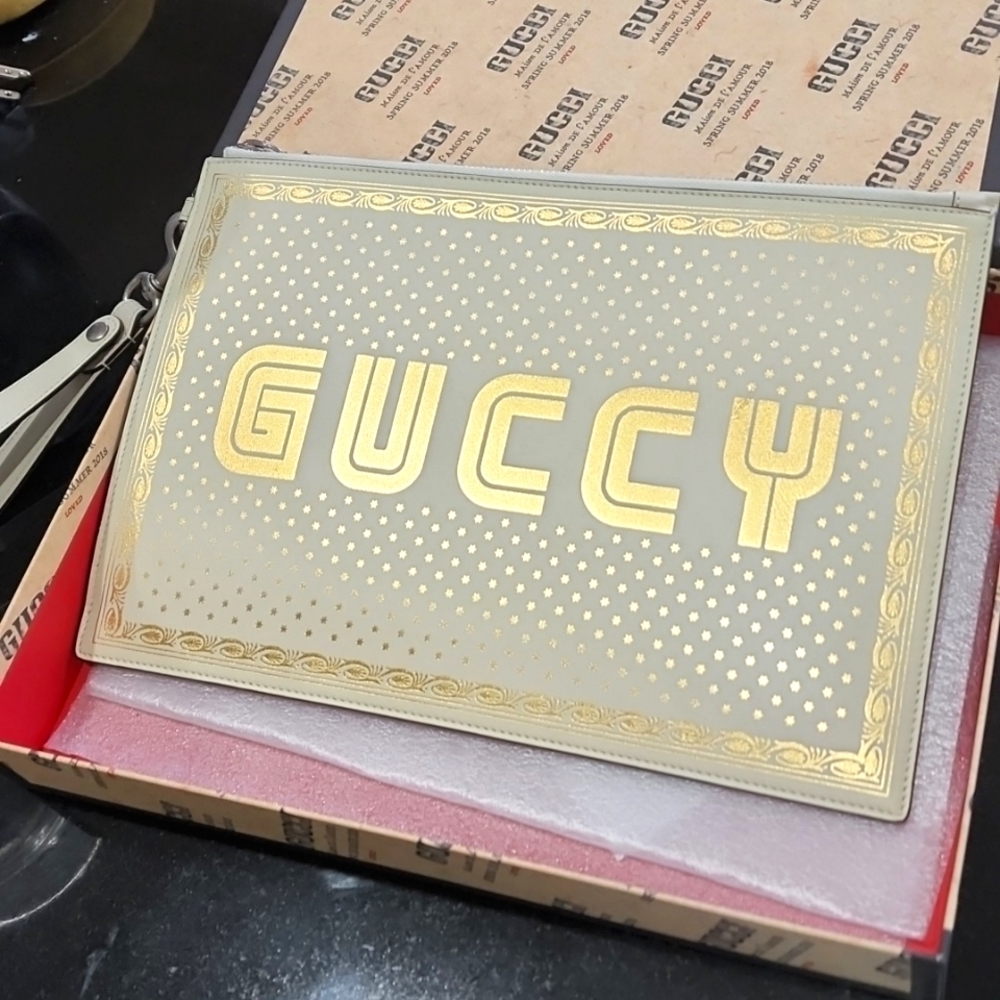 Gucci "Guccy" ivory clutch/wristlet